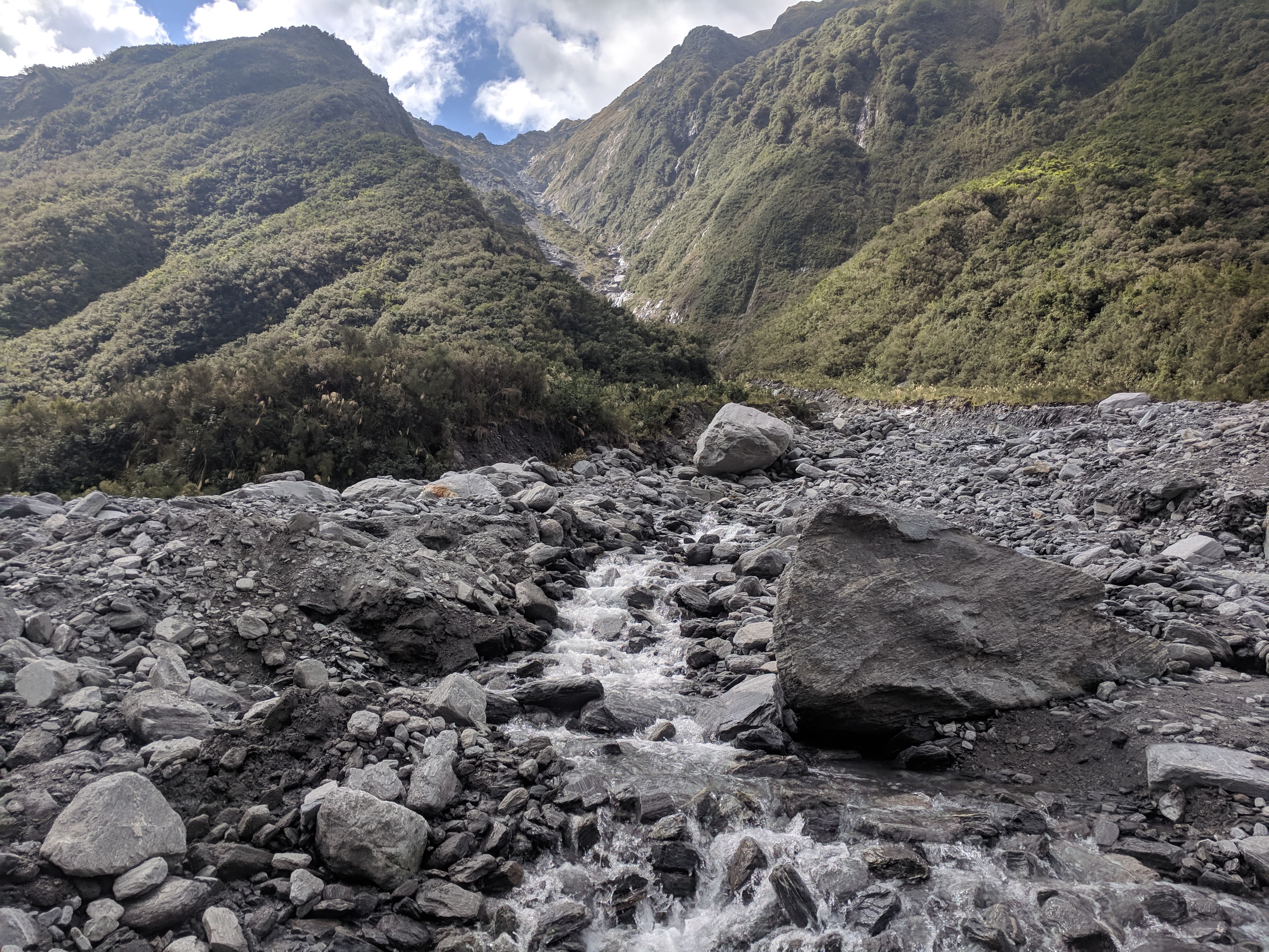 Some water rolling over rocks near Fox Glacier