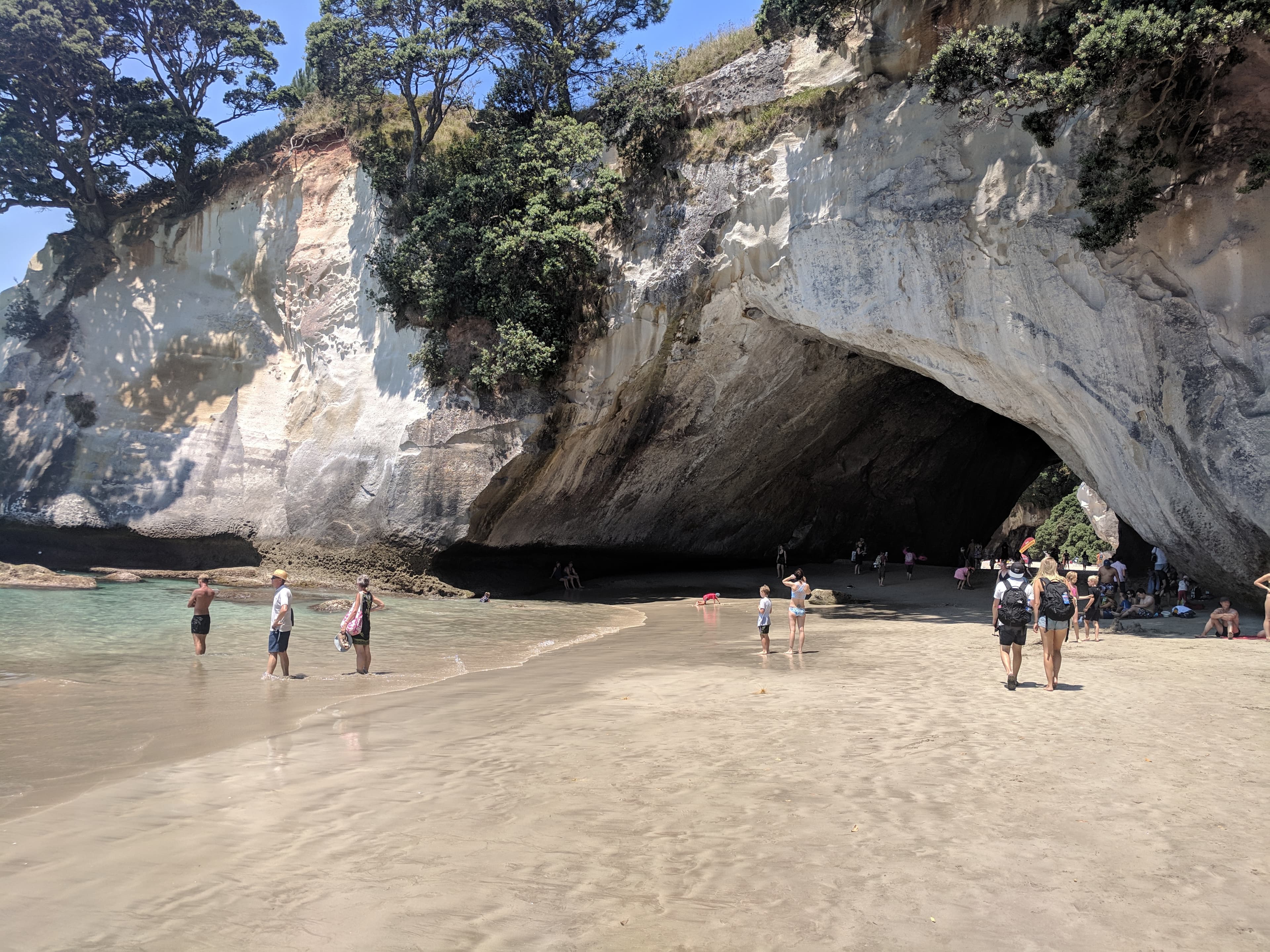People gathered at Cathedral Cove People gathered at Cathedral Cove