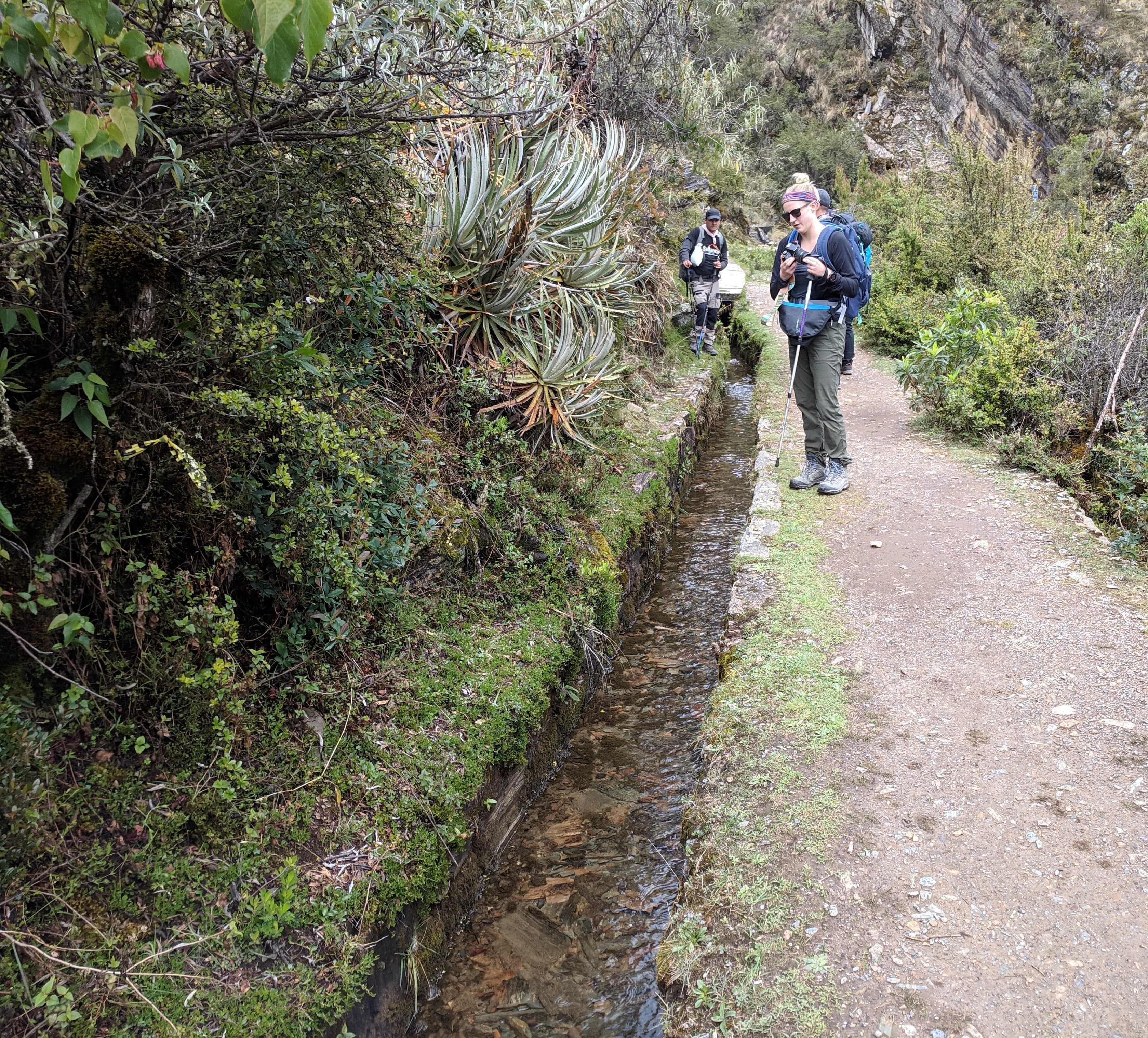 Lauren scoping out an aqueduct to drop Gerrod's rock in