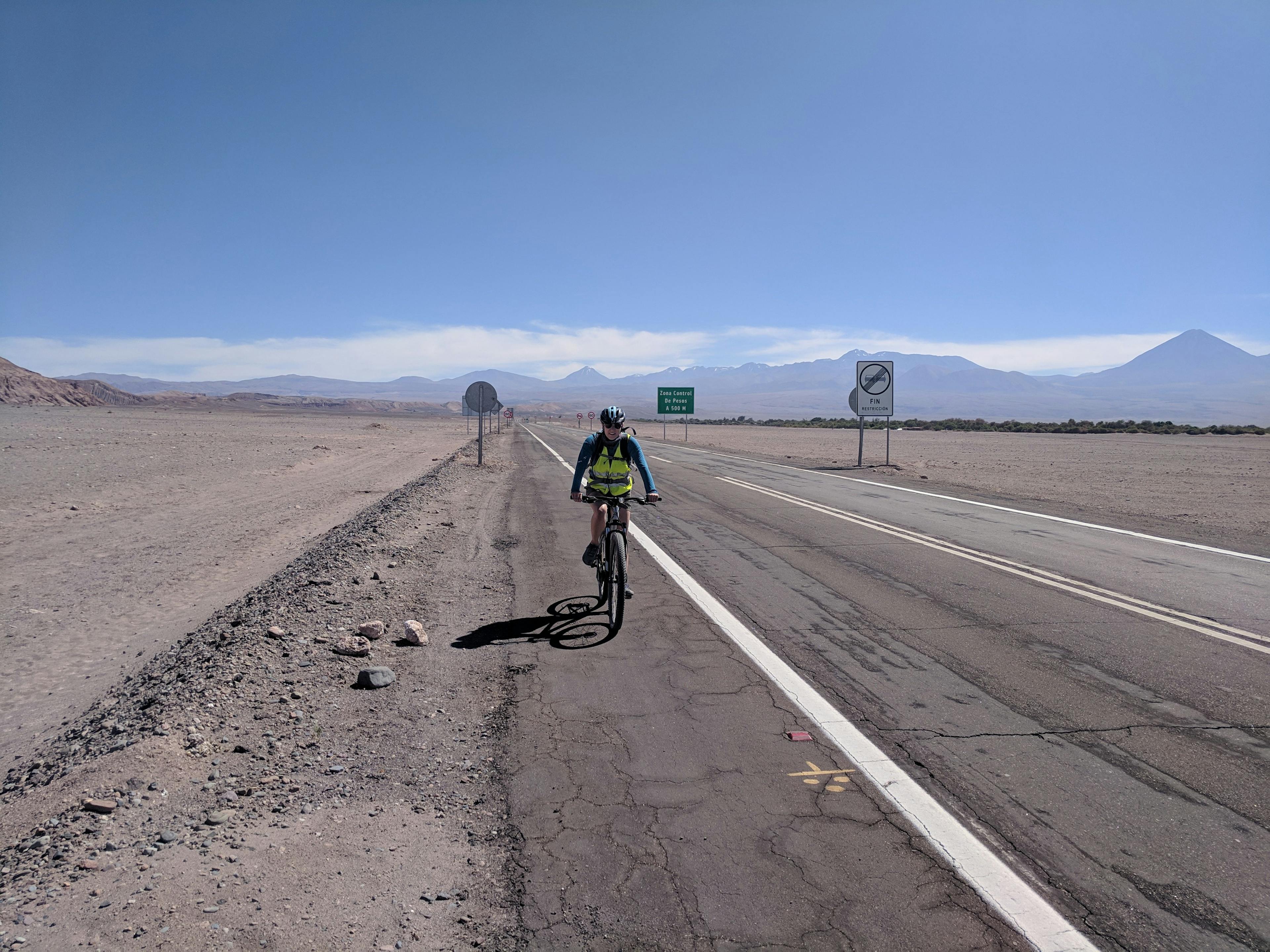 Lauren riding the rental bike through the desert